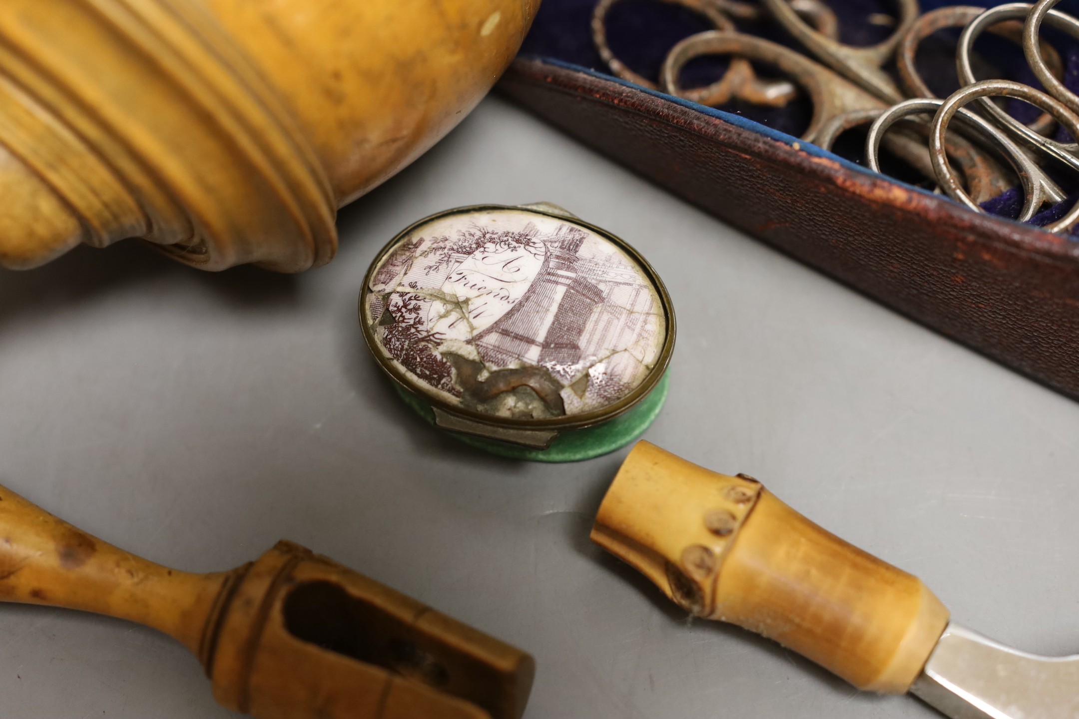 A boxwood spinning top, cased set of scissors, oval patch box and boxed Asprey